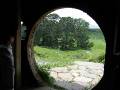 40-BagEnd Inside the real Bag End ... the interior shots of Bag End were filmed on a sound stage in Wellington, but the real Bag End was actually dug into the hill, and was an unfurnished/dirt/chicken wire square that had enough area to fit about 20 people or so ... and yes, the circular doors were really only about four and a half or five feet tall