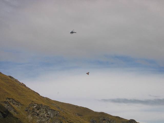 25-HelicopteredRafters While we were out there, we saw this helicopter making several trips back and forth with rafters for a new house that was being built somewhere out there in the remote wilderness ... needless to say, the people building the house have to be filthy rich, to be able to afford to have their building materials helicoptered in